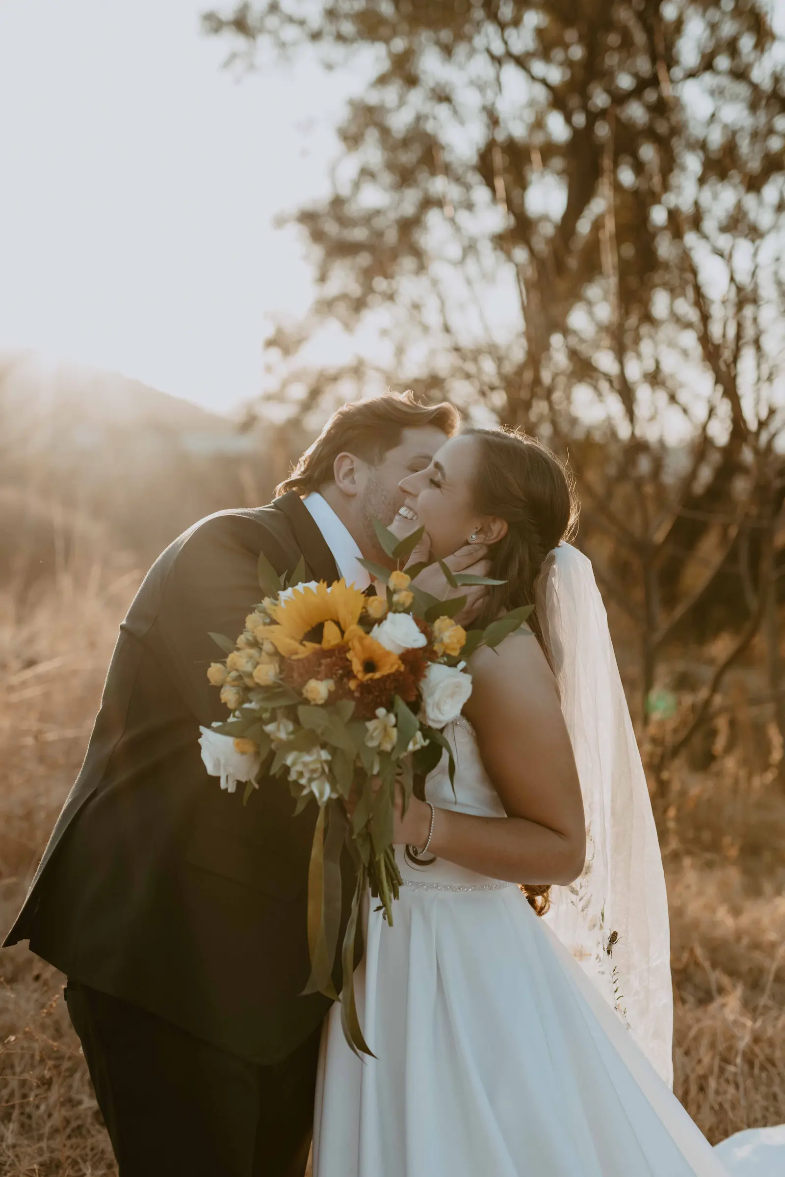 Picure of Cait & Steve outdoors at their wedding done by Two Balloons Weddings & Events