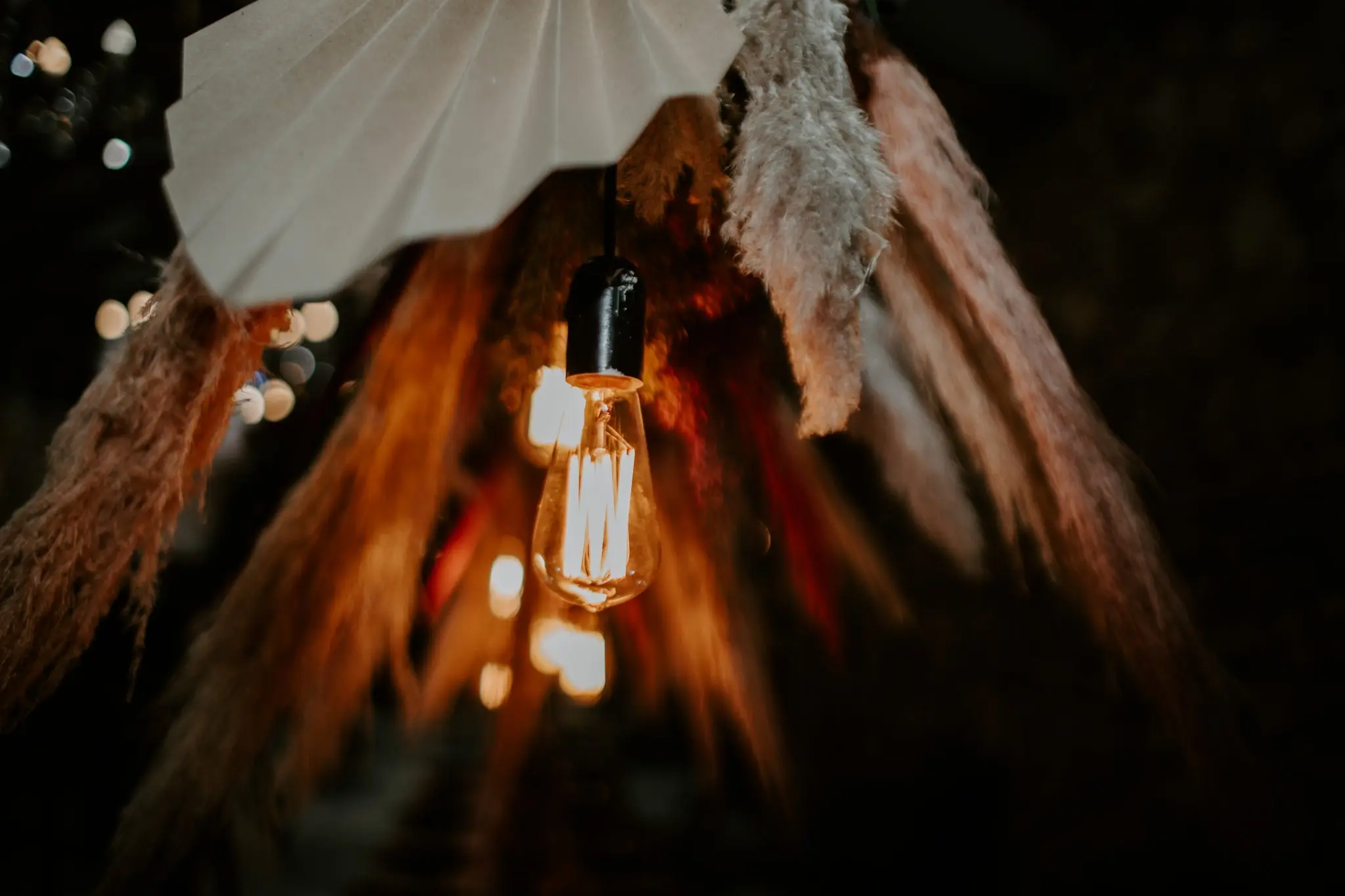 A picure of a loght bulb and floral decor by Two Balloons Weddings & Events