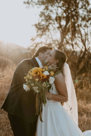 Picure of Cait & Steve outdoors at their wedding done by Two Balloons Weddings & Events